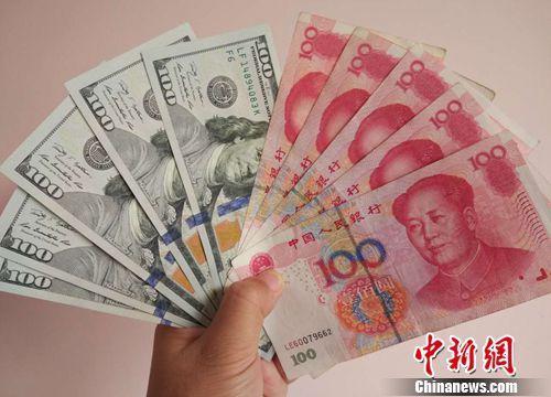 資料圖：人民幣和美元。<a target='_blank'  >中新網(wǎng)</a>記者 李金磊 攝