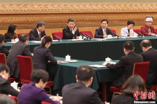 3月7日，中共中央總書記、國家主席、中央軍委主席習(xí)近平參加十三屆全國人大一次會議廣東代表團(tuán)的審議。<a target='_blank' >中新社</a>記者 盛佳鵬 攝