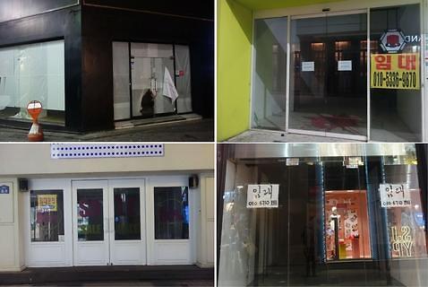 中國僑網明洞眾多店面前貼有“租賃”字樣的標識。(韓國亞洲經濟中文網)